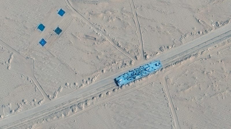 Satellite images show China built mock-ups of U.S. warships
