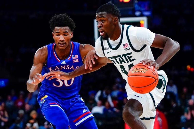 Michigan State's Gabe Brown (44) drives past Kansas' Ochai Agbaji (30)