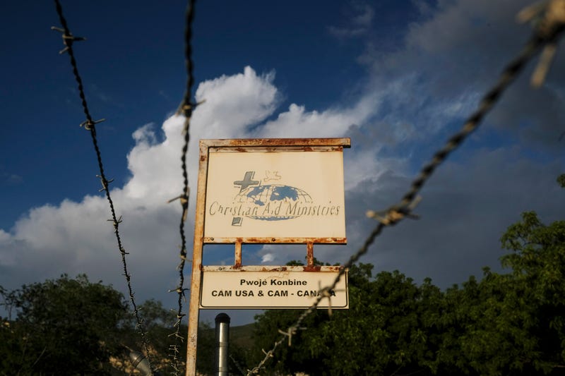 This Oct. 21, 2021, photo shows a sign outside Christian Aid Ministries in Titanyen, Haiti, which had 17 of their members kidnapped by the 400 Mawozo gang.