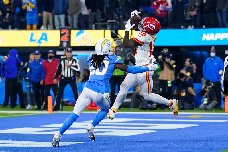 Kansas City Chiefs wide receiver Tyreek Hill, right, grabs a pass in the end zone for a touchdown