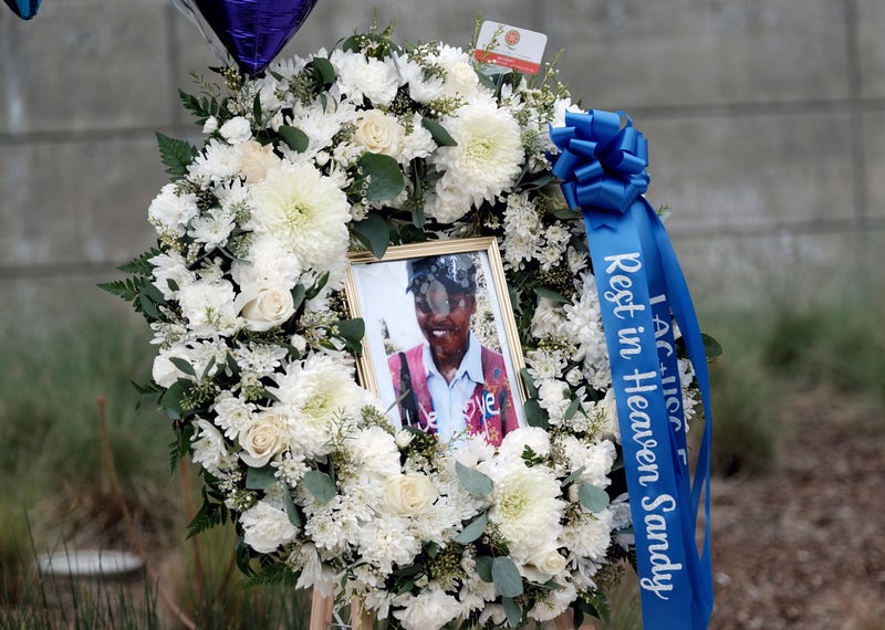 A photo of Sandra Shells is seen in a memorial wreath in downtown Los Angeles on Jan. 19, 2022, at the bus stop where she was attacked the week before.