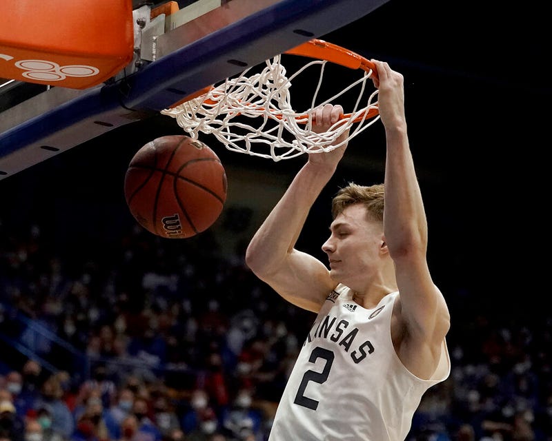 Kansas guard Christian Braun (2) dunks the ball