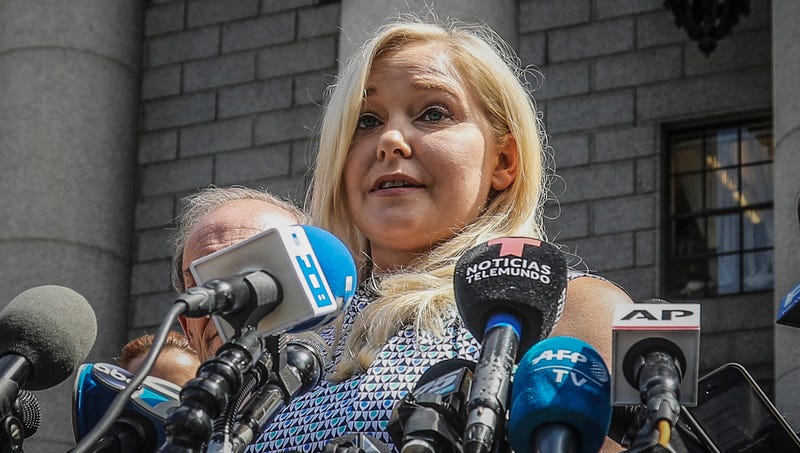 Virginia Roberts Giuffre holds a news conference outside a Manhattan court following the jailhouse death of Jeffrey Epstein, Aug. 27, 2019, in New York. A tentative settlement has been reached in a lawsuit accusing Prince Andrew of sexually abusing a 17-year-old American, according to a court filing Tuesday, Feb. 15, 2022.