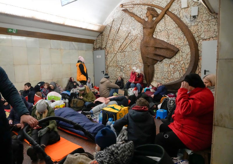 People gather in the Kyiv subway, using it as a bomb shelter in Kyiv, Ukraine, Friday, Feb. 25, 2022