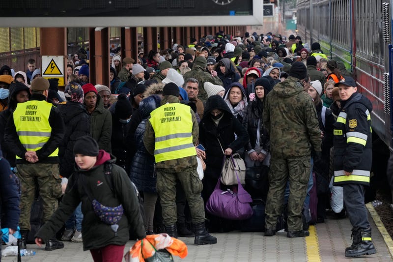 Refugees from Ukraine arrive to the railway station in Przemysl, Poland, Sunday, Feb. 27, 2022