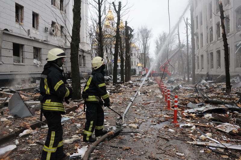 Firefighters extinguish a building of Ukrainian Security Service (SBU) after a rocket attack in Kharkiv, Ukraine's second-largest city, Ukraine, Wednesday, March 2, 2022