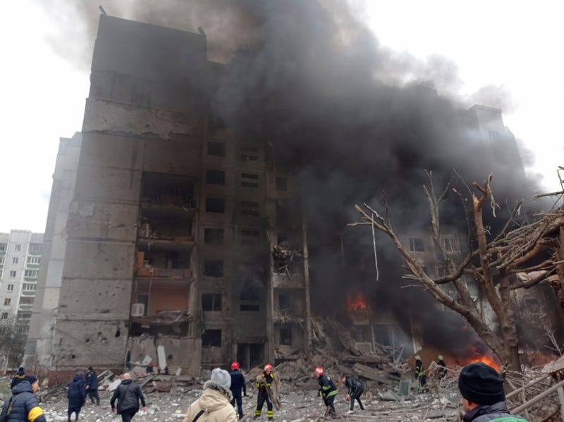 Firefighters work to extinguish a fire at a damaged city center after a Russian air raid in Chernigiv, Ukraine, Thursday, March 3, 2022
