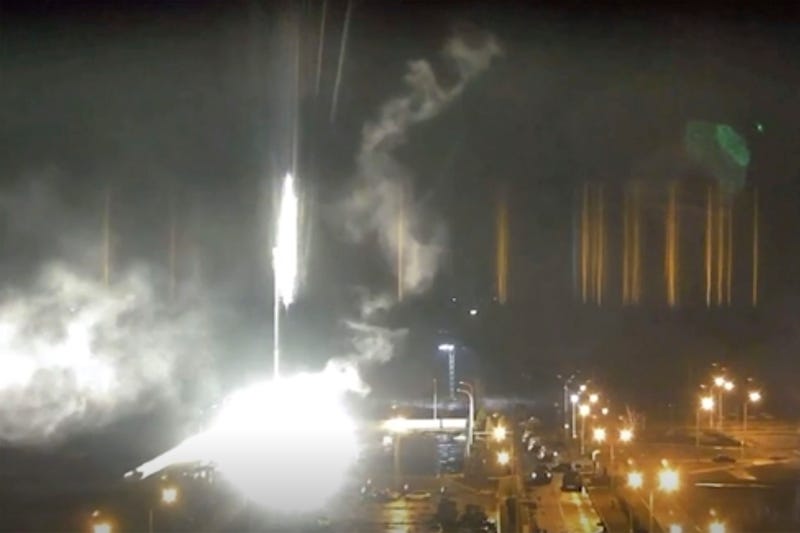 This image made from a video released by Zaporizhzhia nuclear power plant shows bright flaring object landing in grounds of the nuclear plant in Enerhodar, Ukraine Friday, March 4, 2022
