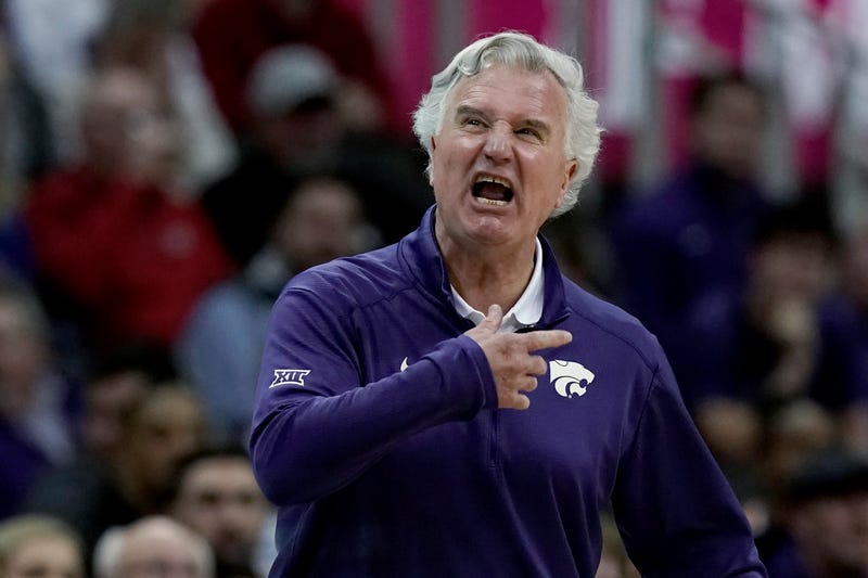 Kansas State coach Bruce Webber talks to players during the first half of the team's NCAA college basketball game against West Virginia