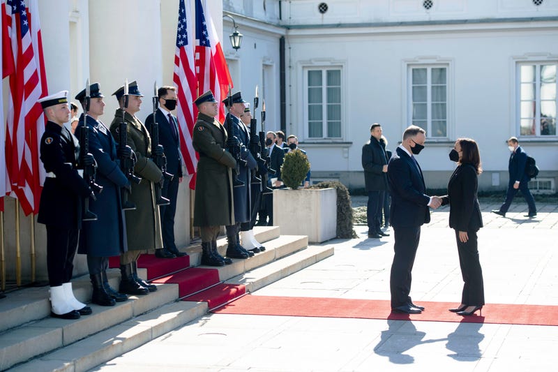 Poland's President Andrzej Duda, second right, greets US Vice President Kamala Harris as she arrives for meetings at Belwelder Palace, in Warsaw, Poland, Thursday, March 10, 2022