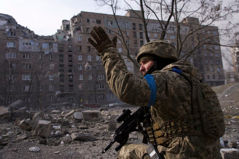 A Ukrainian serviceman guards his position in Mariupol, Ukraine