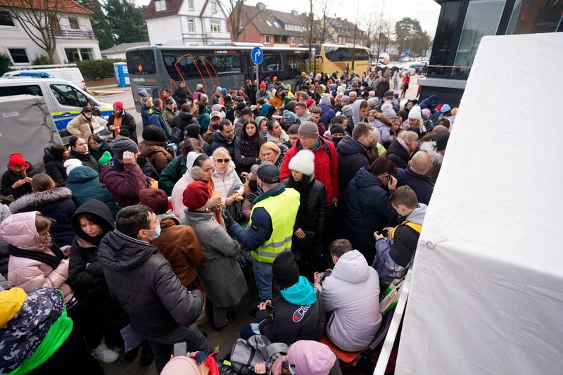Refugees from Ukrainian wait for admission in front of the registration office for refugees inn Hamburg, Germany, Monday, March 14, 2022