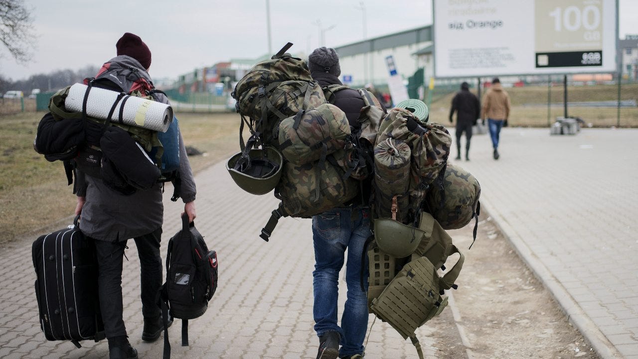 Foreign fighters in Ukraine await weapons in chaos of war