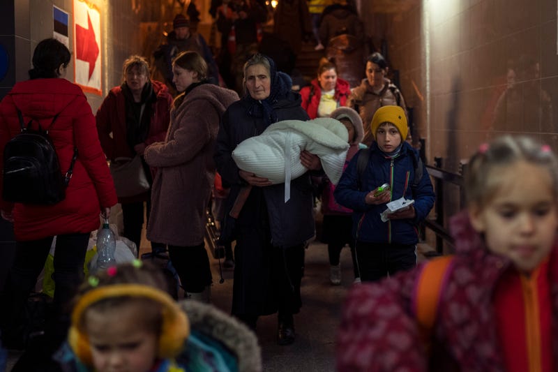 People who fled the war in Ukraine leave Przemysl train station in Przemysl, Poland, Tuesday, March 15, 2022.