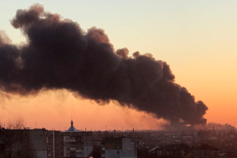 A cloud of smoke raises after an explosion in Lviv, western Ukraine, Friday, March 18, 2022. The mayor of Lviv says missiles struck near the city's airport early Friday.