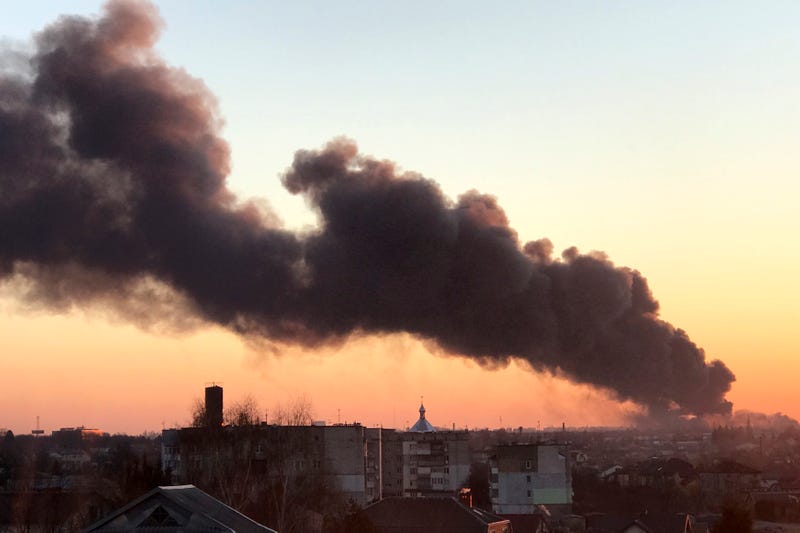 A cloud of smoke raises after an explosion in Lviv, western Ukraine, Friday, March 18, 2022