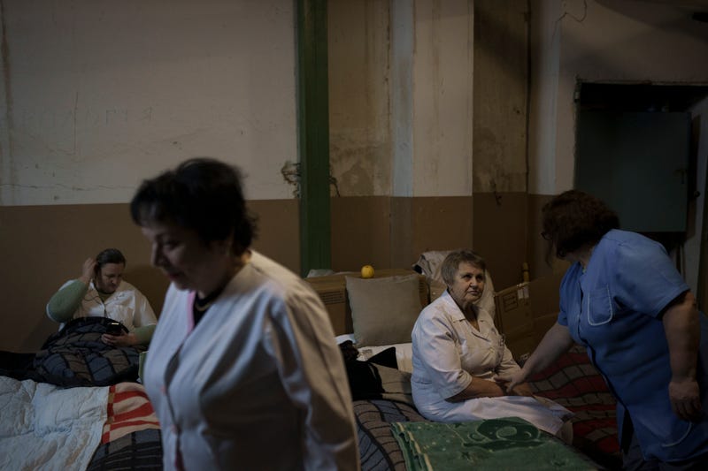 Medical staff rest in a basement used as a bomb shelter at the Ohmatdyt children's hospital 