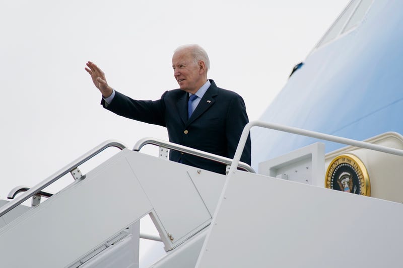 President Joe Biden waves as he boards Air Force One at Andrews Air Force Base, Md., Wednesday, March 23, 2022