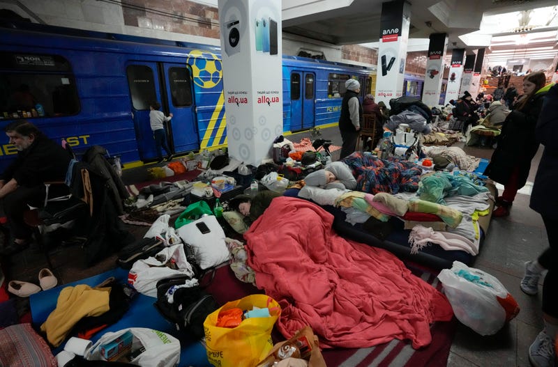 People with their belongings hide in a city subway that they have used as a bomb shelter for over three weeks as they save themselves from the Russian shelling in Kharkiv, Ukraine, Thursday, March 24, 2022