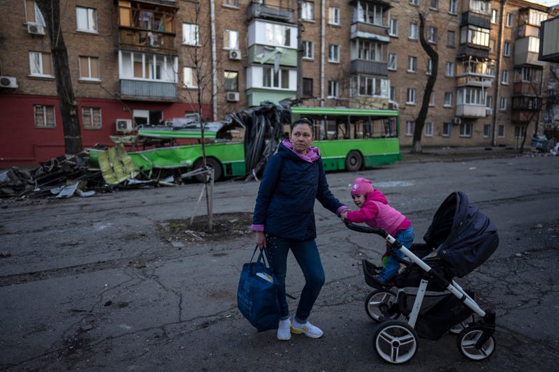 Lena Danilova, 39, walks with her daughter Kira, 2, near her house in Podolskyi neighborhood, Kyiv, Ukraine.