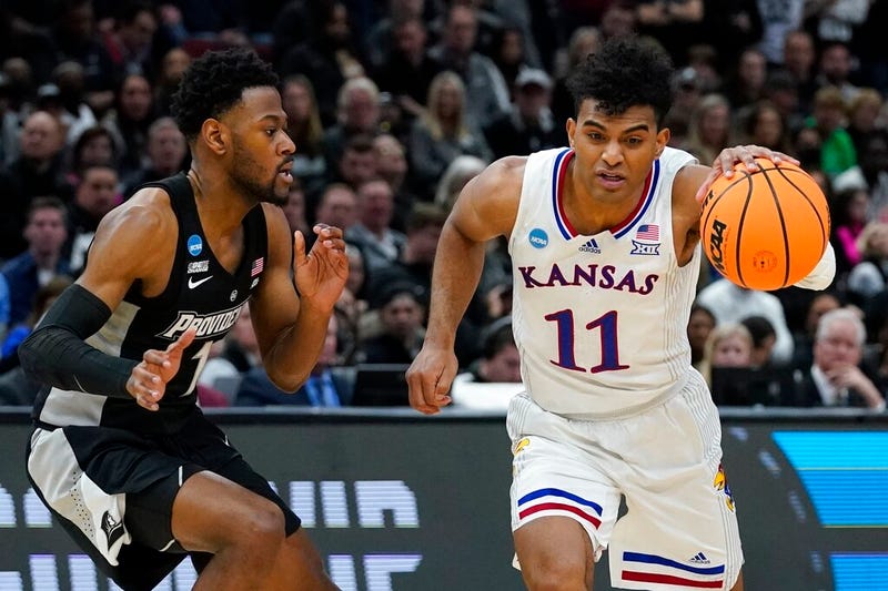 Kansas' Remy Martin drives past Providence's Al Durham
