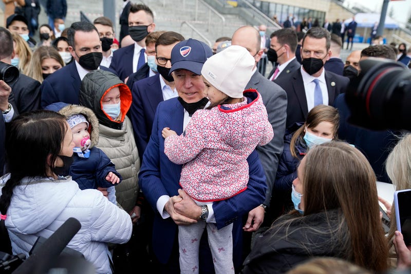 President Joe Biden meets with Ukrainian refugees and humanitarian aid workers during a visit to PGE Narodowy Stadium, Saturday, March 26, 2022, in Warsaw. 