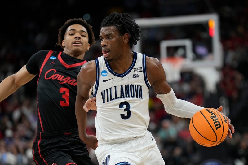 Villanova forward Brandon Slater drives to the basket past Houston guard Ramon Walker Jr. during the first half of a college basketball game in the Elite Eight round of the NCAA tournament on Saturday, March 26, 2022, in San Antonio. 
