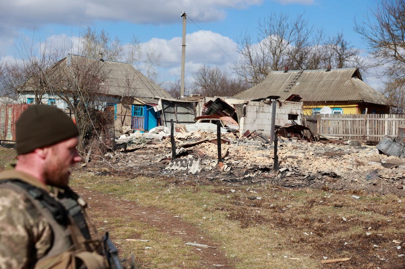 A garage with a car inside, damaged by fighting between Russian and Ukrainian troops in Lukyanivka, Kyiv region, Ukraine, Monday, March 27, 2022