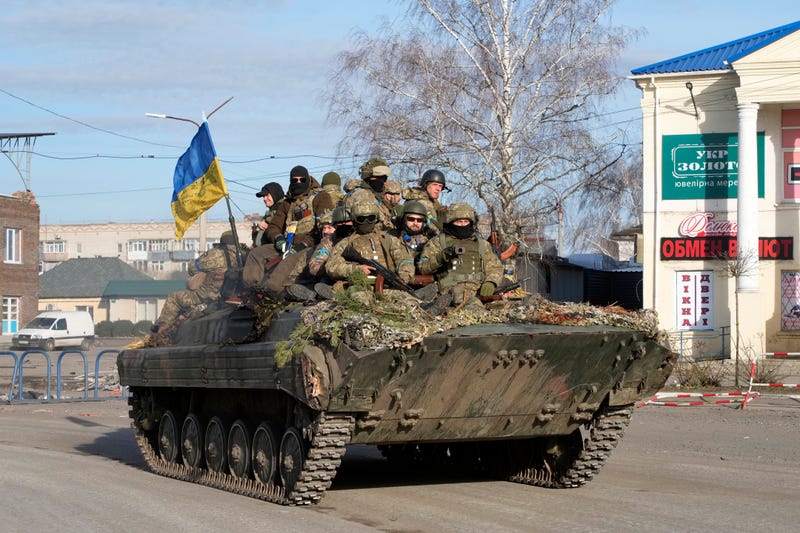 Ukrainian soldiers ride a tank through the town of Trostsyanets, about 250 miles east of Kyiv, Ukraine, Monday, March 28, 2022
