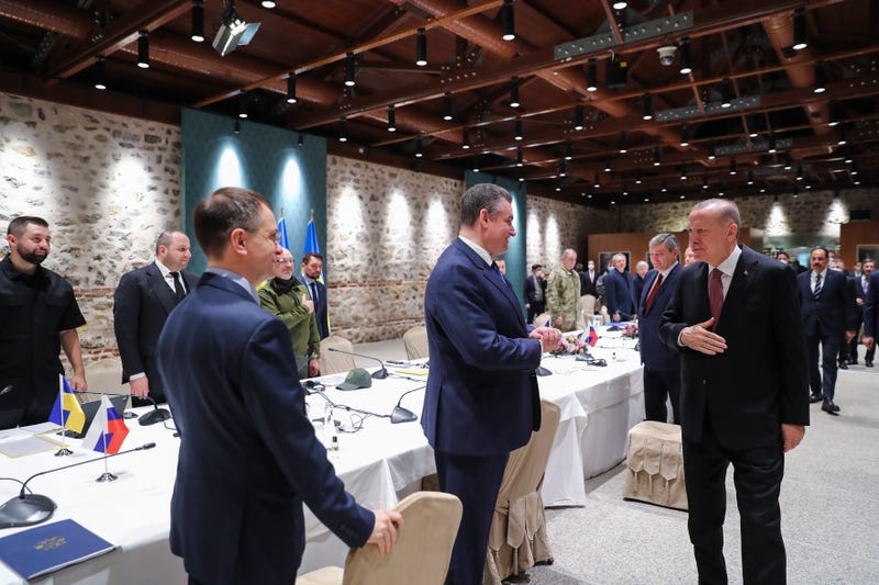 In this photo provided by Turkish Presidency, Turkish President Recep Tayyip Erdogan, right, greets the Russian and Ukrainian delegations ahead of their talks, in Istanbul, Turkey, Tuesday, March 29, 2022