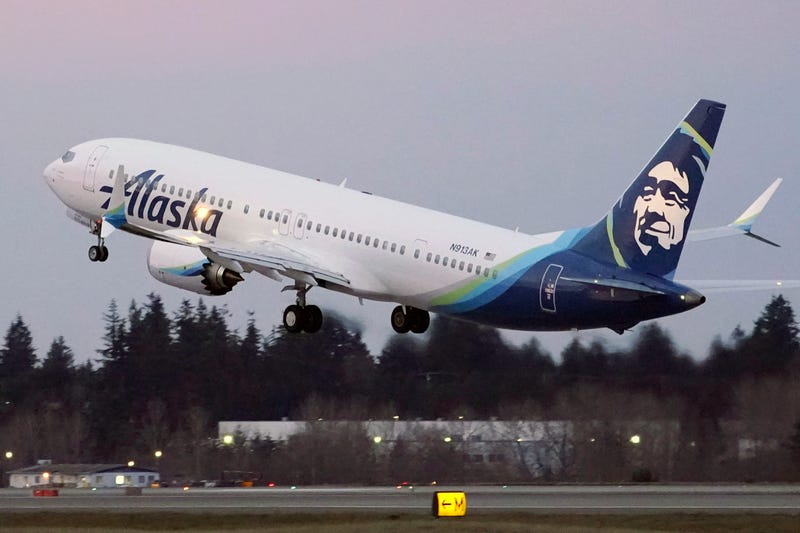 FILE - In this Monday, March 1, 2021 file photo, The first Alaska Airlines passenger flight on a Boeing 737-9 Max airplane takes off on a flight to San Diego from Seattle-Tacoma International Airport in Seattle. Dozens of flights along the U.S. West Coast were canceled Friday, April 1, 2022 as Alaska Airlines pilots picketed during ongoing contract negotiations with the airline.