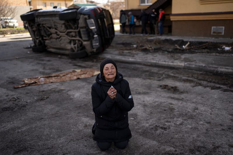 Tanya Nedashkivs'ka, 57, mourns the death of her husband, killed in Bucha, on the outskirts of Kyiv, Ukraine, Monday, April 4, 2022. Russia is facing a fresh wave of condemnation after evidence emerged of what appeared to be deliberate killings of civilians in Ukraine.