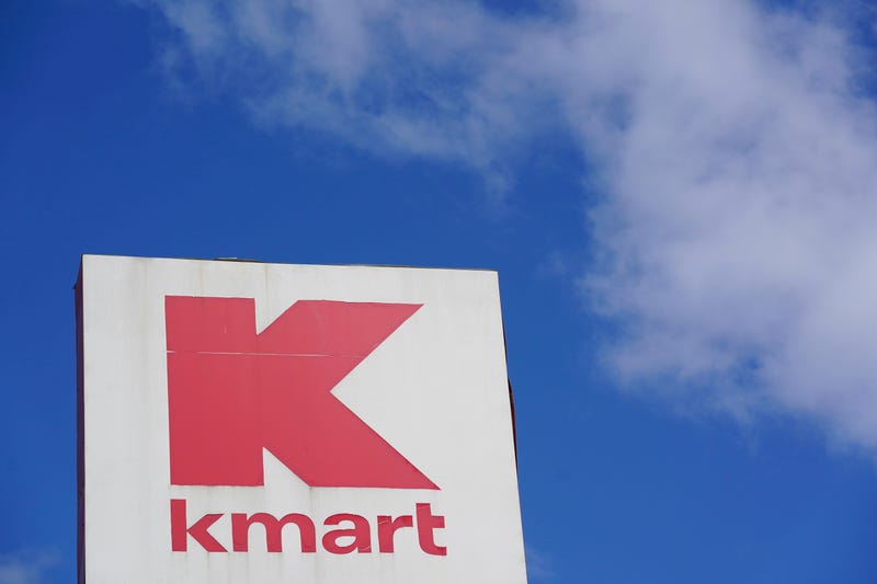 FILE - A large Kmart sign is displayed in front of a shopping plaza in Avenel, N.J., Monday, April 4, 2022. When the Kmart in Avenel closes its doors on April 16, it will leave only three remaining U.S. locations for the former retail powerhouse. It's a far cry from the chain's heyday in the 1980s and ‘90s when it had more than 2,000 stores and sold product lines endorsed by Martha Stewart and former “Charlie's Angel” Jaclyn Smith. 