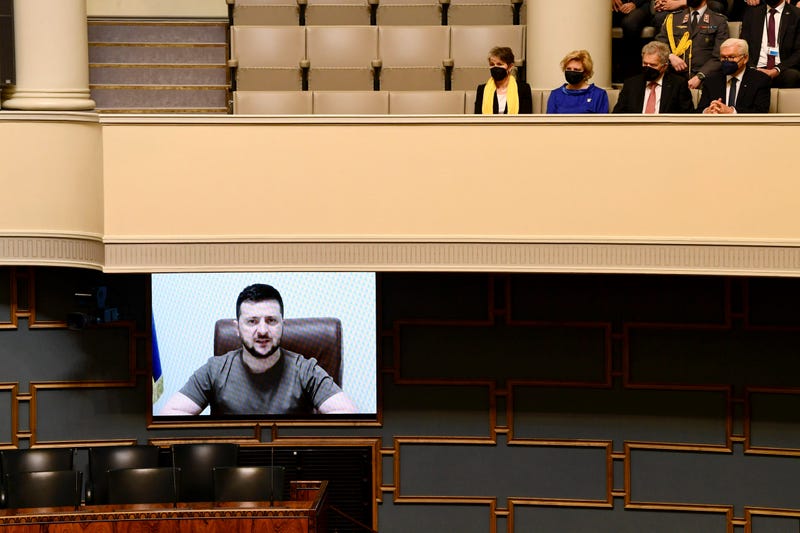 Finnish MP's listen to Ukrainian President Volodymyr Zelenskyy during his virtual address to the Finnish Parliament in Helsinki, Finland, Friday, April 8, 2022