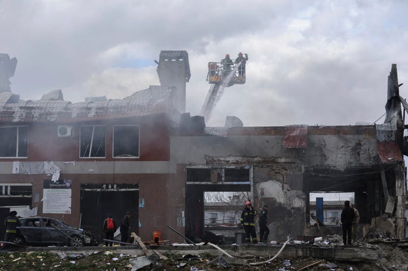 Firefighters work to extinguish a fire after an airstrike hit a tire shop in Lviv, Ukraine, Monday, April 18, 2022. Russian missiles hit the city of Lviv in western Ukraine on Monday, killing at least six people, Ukrainian officials said, as Moscow's troops stepped up strikes on infrastructure in preparation for an all-out assault on the east.