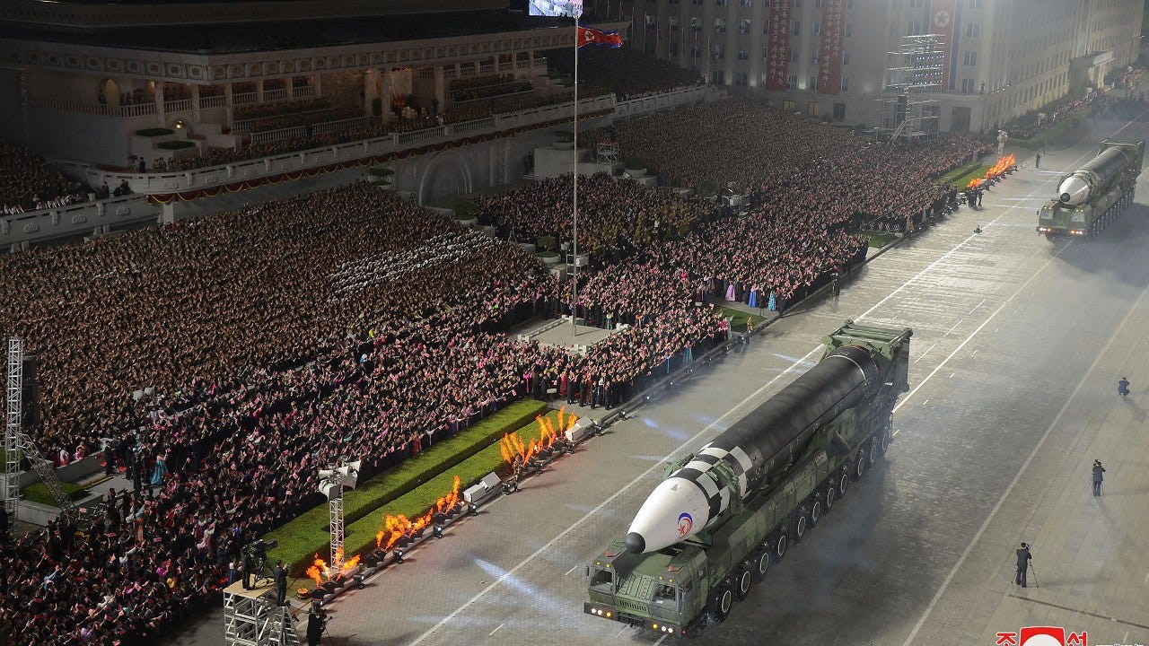 North Korea's Kim vows to bolster nuclear capability during parade