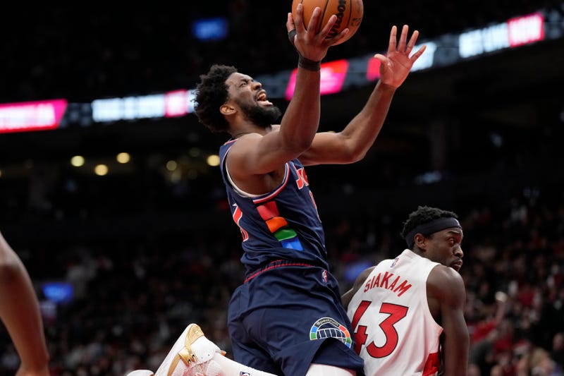 Philadelphia 76ers center Joel Embiid (21) collides with Toronto Raptors forward Pascal Siakam (43) during the second half of Game 6 of an NBA basketball first-round playoff series in Toronto, April 28, 2022. 