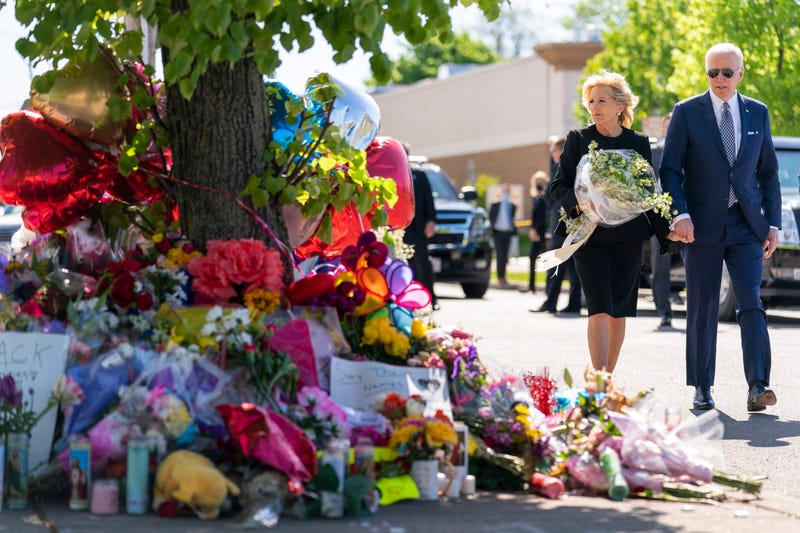 President Joe Biden and First Lady Jill Biden pay their respects to the victims of Saturday's shooting at a memorial outside the TOPS Market in Buffalo, New York, on Tuesday, May 17, 2022