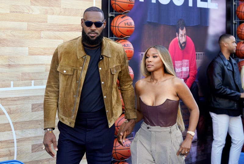 LeBron James, a producer of the Netflix film "Hustle," and his wife Savannah arrive at the premiere of the film.