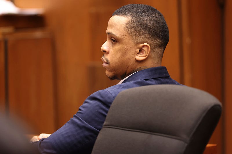 Defendant Eric Holder listens during opening statements in his murder trial, Wednesday, June 15, 2022, at Los Angeles Superior Court in Los Angeles. Holder, 32, faces one count of first degree-murder and two counts of attempted first-degree murder for the killing the Grammy Award-winning rapper Nipsey Hussle outside his clothing store three years ago.