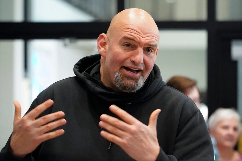 FILE - Pennsylvania Lt. Gov. John Fetterman visits with people attending a Democratic Party event for candidates to meet and collect signatures for ballot petitions for the upcoming Pennsylvania primary election, at the Steamfitters Technology Center in Harmony, Pa., March 4, 2022. The fate of the Democratic Party is intertwined in a pair of Pennsylvania elections that’ll be closely watched this year. John Fetterman could help the party keep control of the Senate.