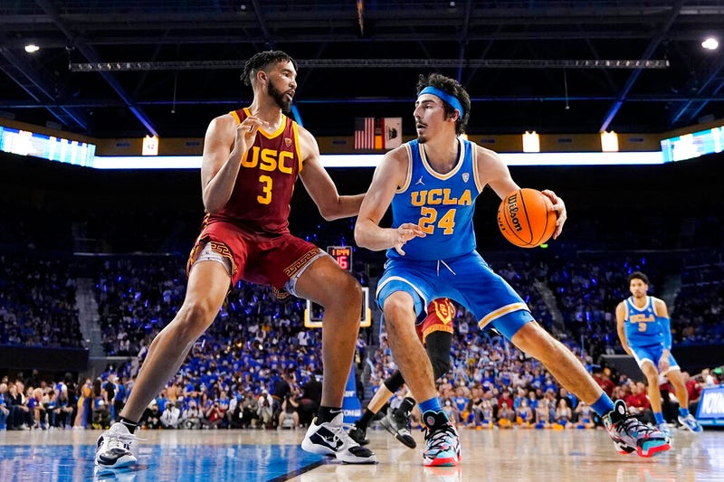 FILE - UCLA guard Jaime Jaquez Jr., right, tries to get by Southern California forward Isaiah Mobley during the second half of an NCAA college basketball game on March 5, 2022, in Los Angeles. UCLA and Southern California are planning to leave the Pac-12 for the Big Ten Conference in a seismic change that could lead to another major realignment of college sports. A person who spoke to The Associated Press on Thursday, June 30, 2022, on condition of anonymity because the schools' talks with the Big Ten have not been made public said the schools have taken steps to request an invitation to join the conference.