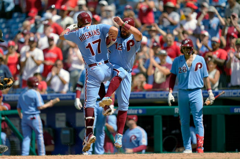 Philadelphia Phillies' Rhys Hoskins (17) celebrates with Kyle Schwarber after hitting a two-run home run off of Washington Nationals relief pitcher Cory Abbott during the fourth inning of a baseball game, Sunday, Aug. 7, 2022, in Philadelphia.