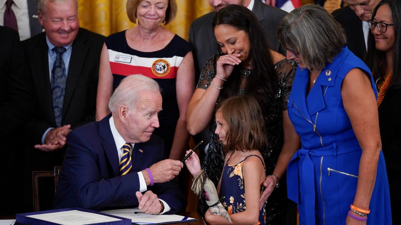 Biden signs 'burn pits' help for vets; a personal win, too