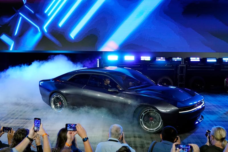 Gas-powered muscle cars drive into the sunset, turn electric