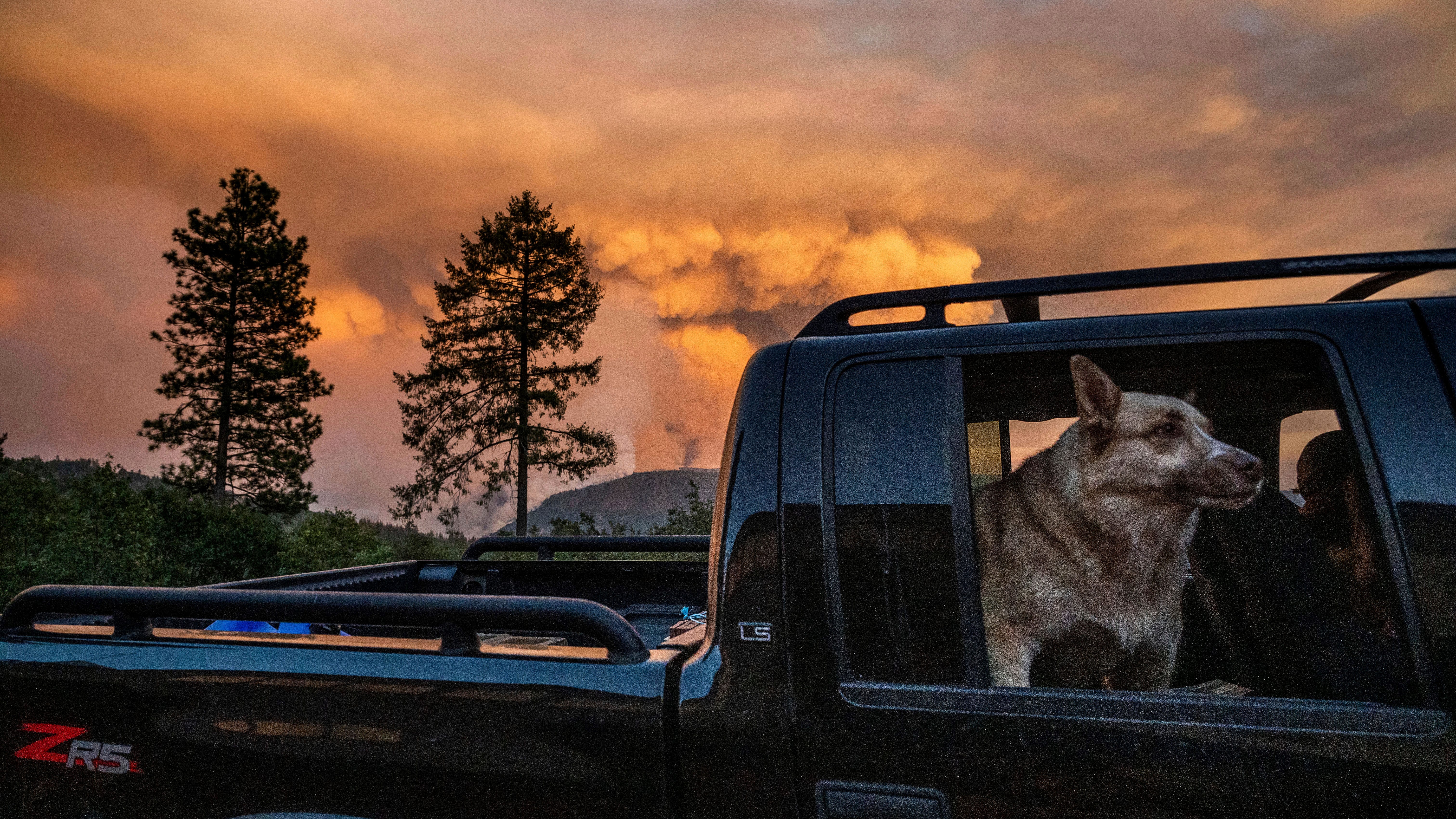 Approaching storm complicates California wildfire fight