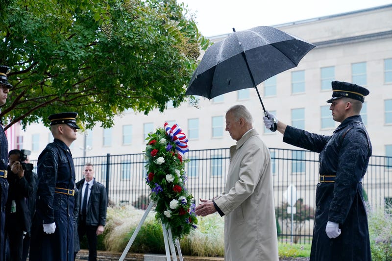 President Joe Biden participates in a wreath laying ceremony while visiting the Pentagon in Washington, Sunday, Sept. 11, 2022, to honor and remember the victims of the September 11th terror attack. 