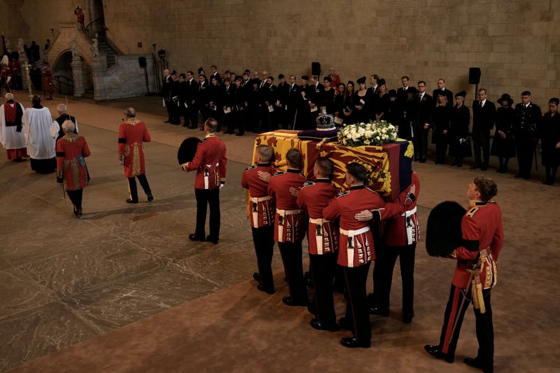 The coffin of Queen Elizabeth II is carried inside Westminster Hall in London, Wednesday, Sept. 14, 2022