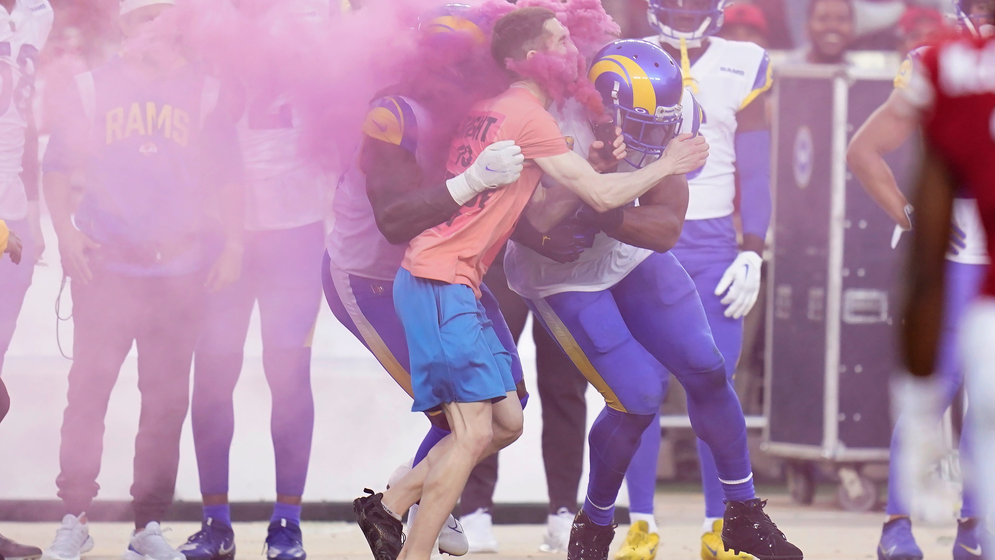 Protester subdued by Rams' Wagner files police report
