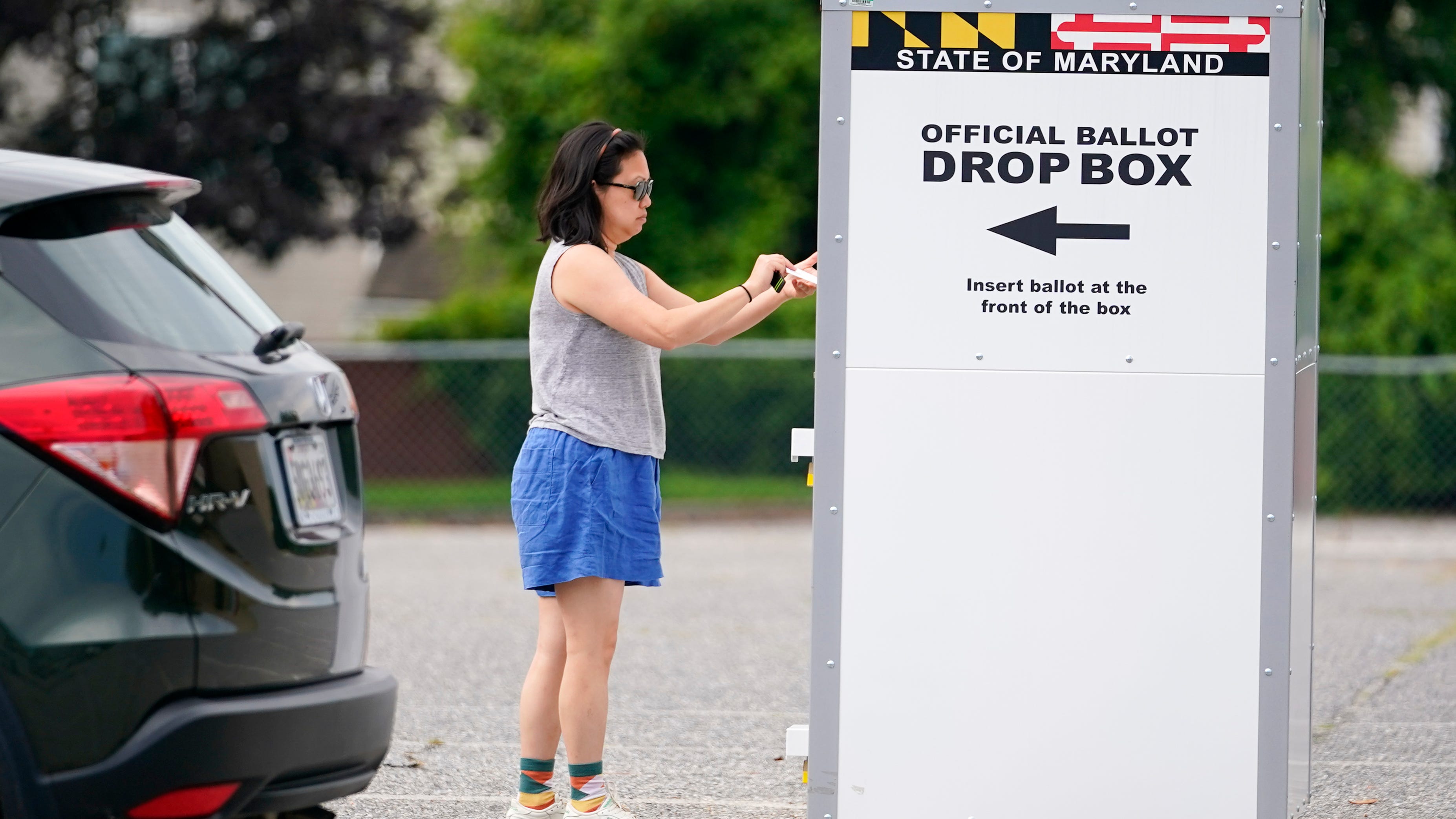 How are mail-in and absentee ballots verified?